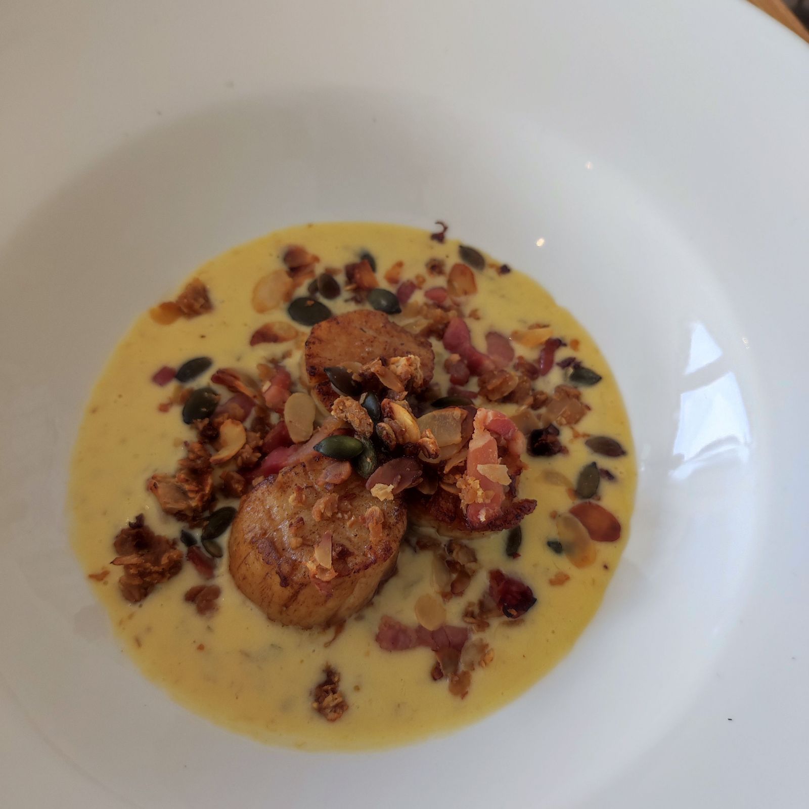 Pan seared scallops, smoked bacon granola, warm tartar